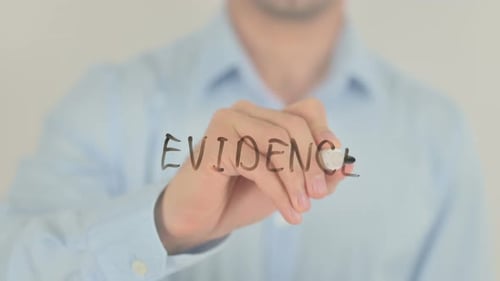 Writing Evidence on Clear Surface Close Up