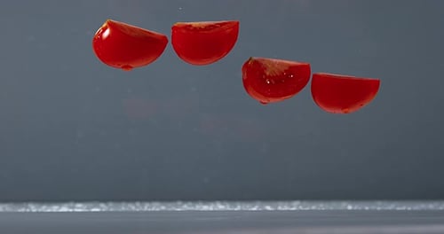 Tomatoes, solanum lycopersicum, Fruits Falling on Water, Slow Motion 4K