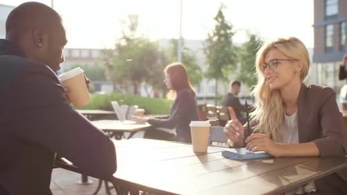 Multiethnic Colleagues Drinking Coffee and Talking