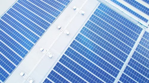 Drone flying over photovoltaic solar panels