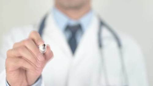 Doctor Writes Ligaments on Clear Surface