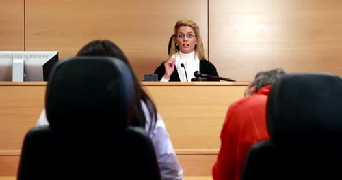 Judge Speaking and Using Gavel in Courtroom