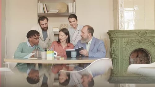 Team Collaborating Around Conference Table in Bright Office