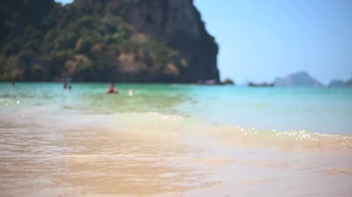Closeup View of Turquoise Ocean Waves Roll in on the Peaceful Shore on Tropical Island