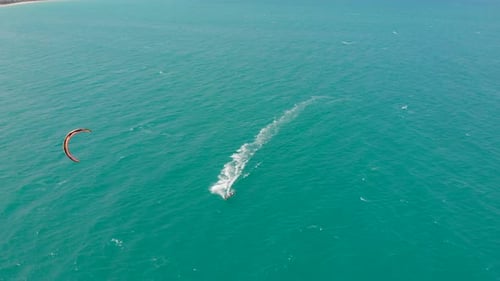 Acrobatic Jump of Professional Kite Surfer on the Sea Wave, Athlete Showing Sport Trick Jumping with
