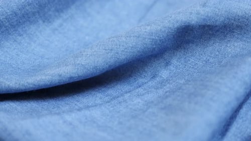 Blue denim high quality texture details fabric close-up tilting 4K 2160p 30fps UltraHD video - Du