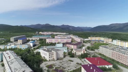 Aerial view of a small town among forests and hills. 06