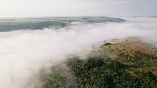 Aerial Drone View of Valley Between Mountains During Foggy Morning