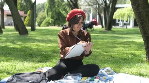 Beautiful Woman Painting Outside