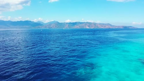 Aerial top view abstract of tranquil coast beach lifestyle by shallow lagoon with white sand backgro