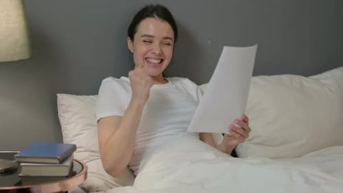 Woman Receives Good News in Bed and Celebrates