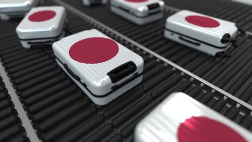 Japanese Flag Suitcases Moving on a Conveyor Belt