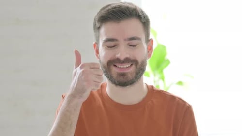 Smiling Man Gives Thumbs Up Approval