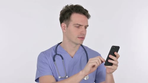Doctor using phone in studio setting