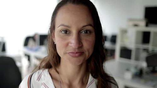 Woman Smiling Portrait in an Office Environment