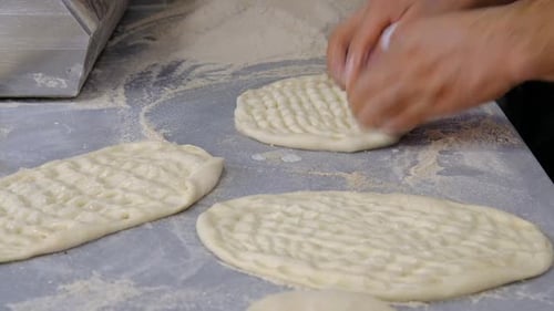 Flatbread Dough Preparation with Hands