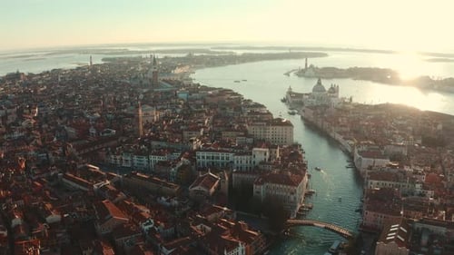 Dolly back establishing drone shot over Central Venice city at sunrise