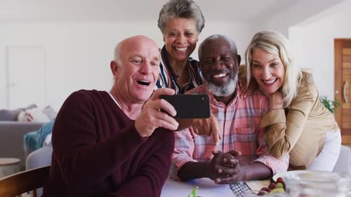 Four Friends Smiling while Taking a Selfie