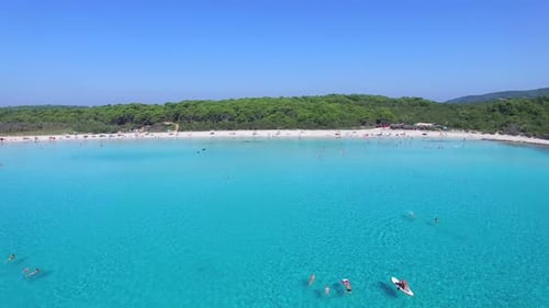 Flying over clear blue mediterranean bay