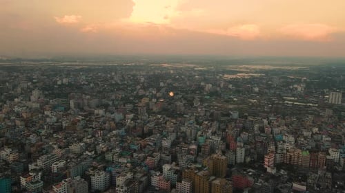 Mega city with densely constructed buildings, aerial view with vivid skyline - establishing drone fl