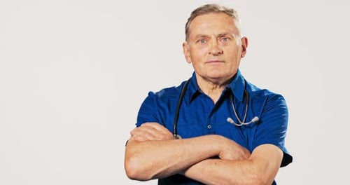 Doctor With Stethoscope Looking at Camera