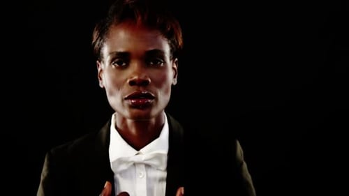 Model in a Suit and Bowtie Posing