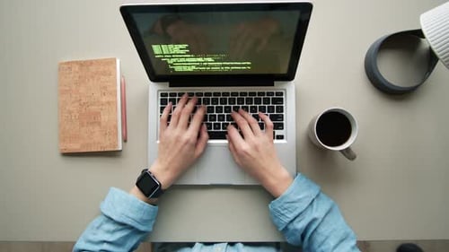 Freelancer Coding on Laptop