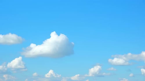 White Clouds Drifting in a Clear Blue Sky