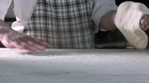 Rolling Out Dough With Flour To Make Turkish Pita 3