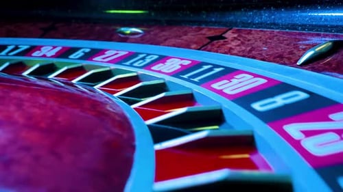 Shot From Casino Roulette Wheel in Motion the Ball Stops at 4 Black