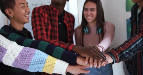 Diverse Group of Friends Stacking Hands Together