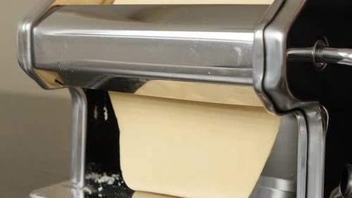 Dough Flattened Through Pasta Machine Close Up
