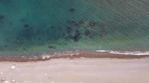 Aerial View From Above on Azure Sea and Pebbles Beach