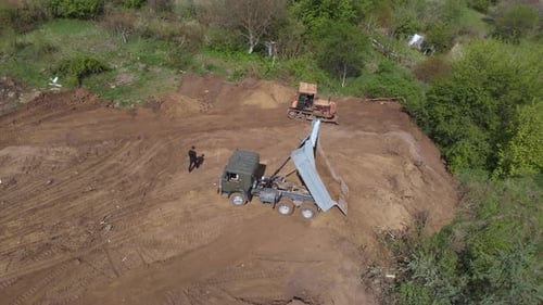 Aerial View of Dump Truck and Bulldozer on Site