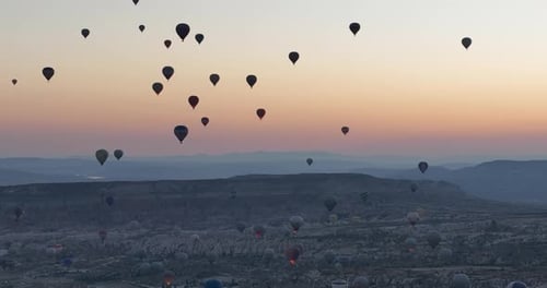Aerial Cinematic Drone View of Colorful Hot Air Balloon Flying Over Cappadocia