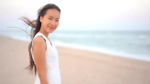 Asian woman enjoy around beautiful beach sea ocean