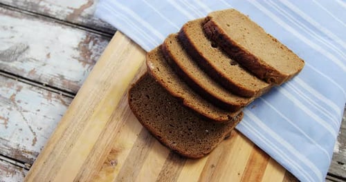 Fresh Sliced Rye Bread on a Wooden Board