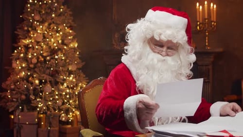 Santa Claus Reading Letters by Christmas Tree
