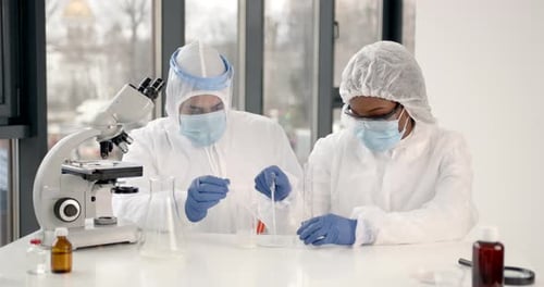 Researchers During Andemic Checking Sample in Biochemistry Lab
