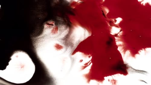Dramatic Red and Black Ink Expanding on White