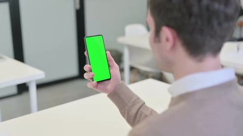 Rear View of Man Using Smartphone with Chroma Screen
