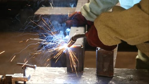 Robotic Arm Welding Metal Pieces Together