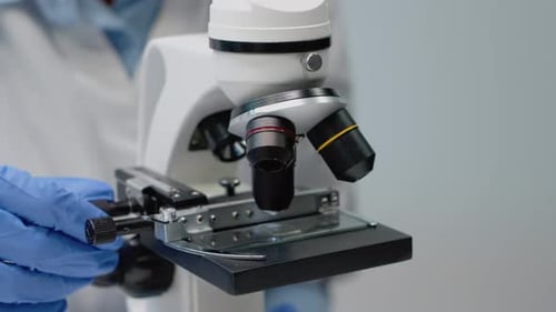 Close Up of Microscope with Glass Slide