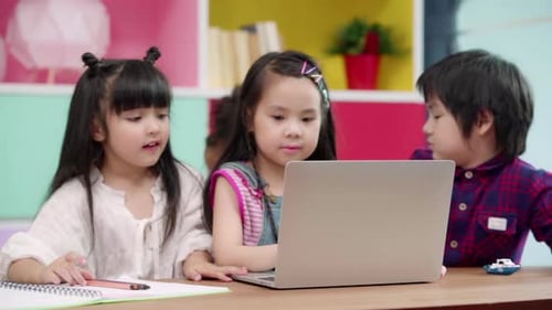 Group of children drawing in classroom, Multi-ethnic young boys and girls happy funny study