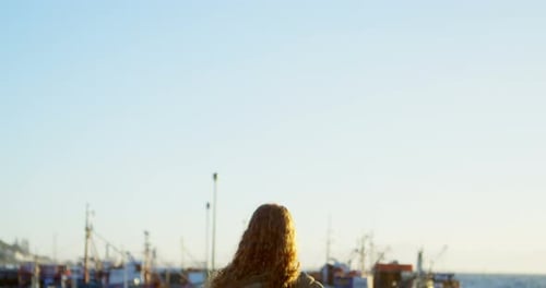 Woman standing on the dock 4k