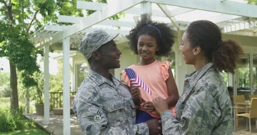 Military Family Reunited in Sunny Suburban Yard