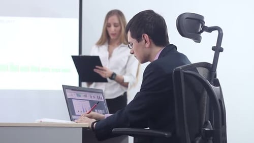 Presentation of Data by Businesswoman in Office