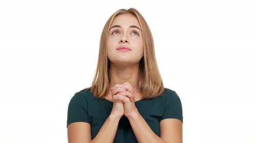 Young Woman Clasping Hands in Hopeful Prayer