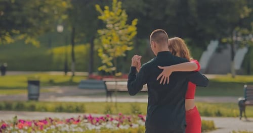 Romantic Couple Dancing Together in Sunny Park