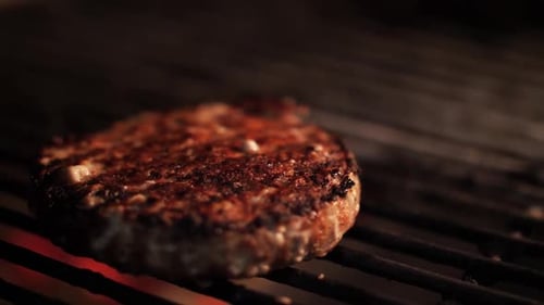 Grilled cutlet. Cooking meat on the grill. Charcoal grill.